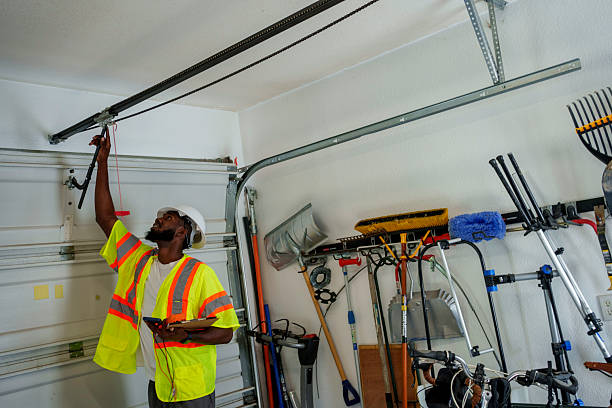 Professional Garage Door Panel Replacement technician working in Greenwood, MS
